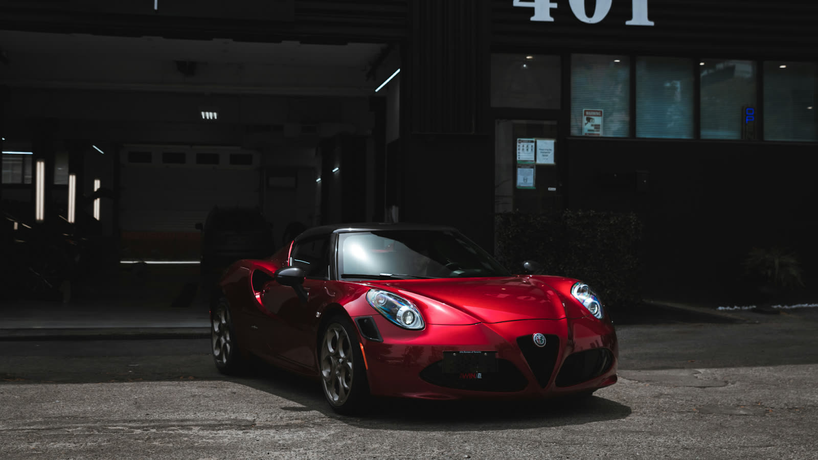 Red luxury sports car parked outside after professional car cleaning Toronto service, showcasing a polished exterior ready for a Valentine’s Day Toronto night out.