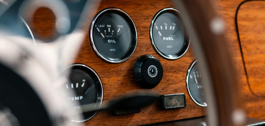 Close up of a classic car dashboard and gauges professionally cleaned by ALPHASHINE auto detailing in Toronto, highlighting precise interior car cleaning near me with refined craftsmanship.