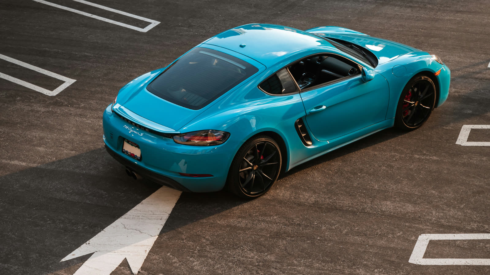 Blue Porsche sports car after professional car detailing Toronto service, showing glossy exterior finish following expert car cleaning Toronto care.