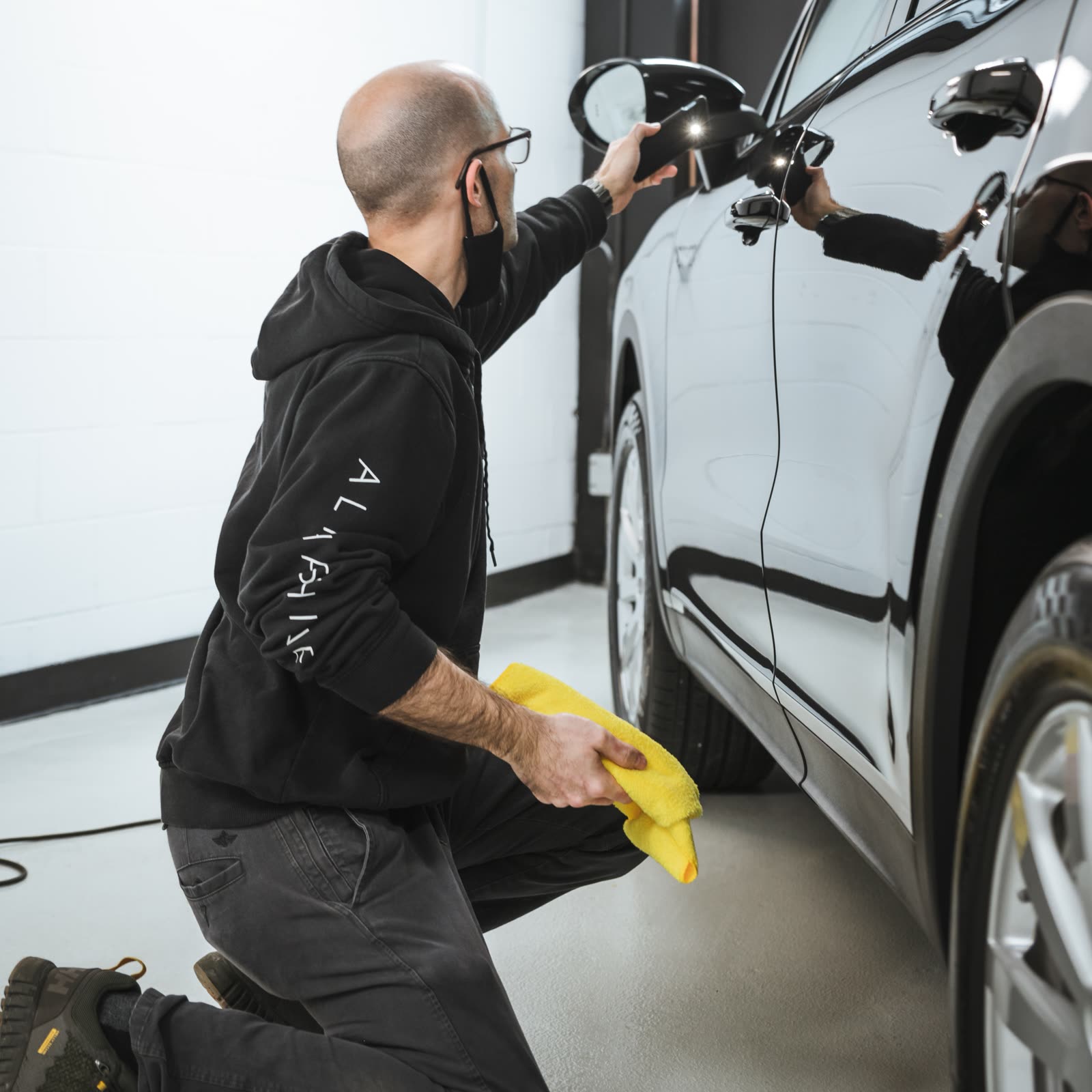 car being polished by alphashine employee