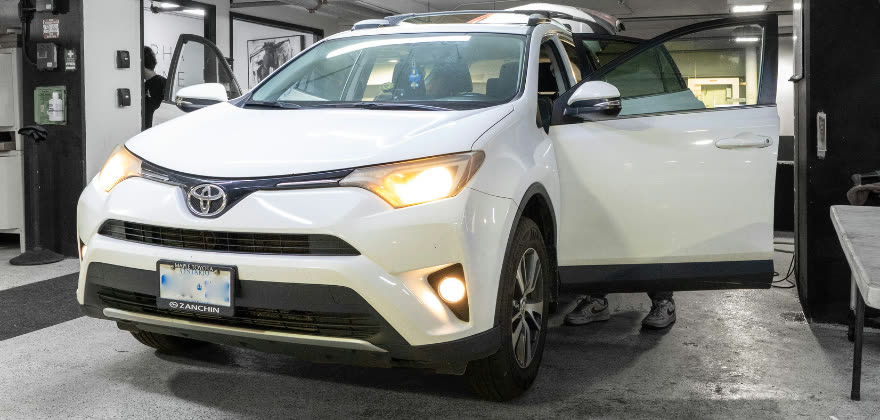 White Toyota SUV receiving professional car detailing from ALPHASHINE in Regent Park, Toronto.